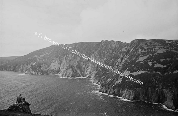 SLIEVE LEAGUE FROM BUNGLASS WITH MRS BYRNE IN FOREGROUND